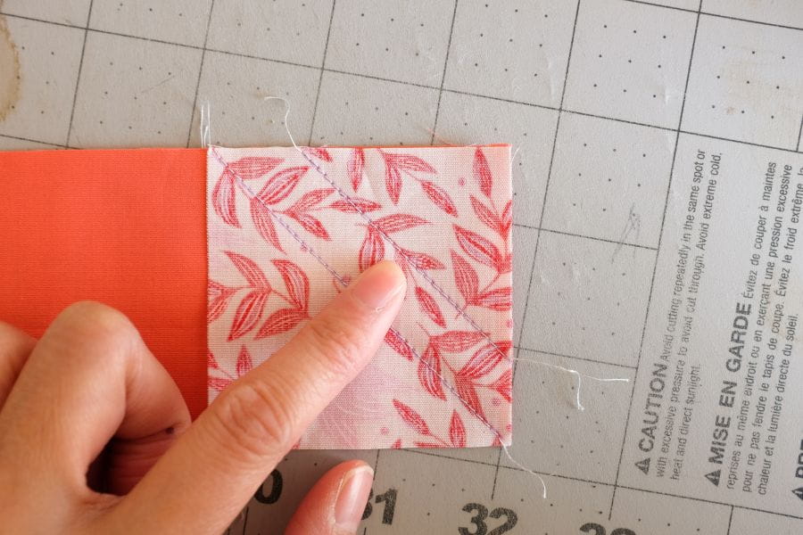 example of marked guideline with a square piece of fabric with stitch diagonally